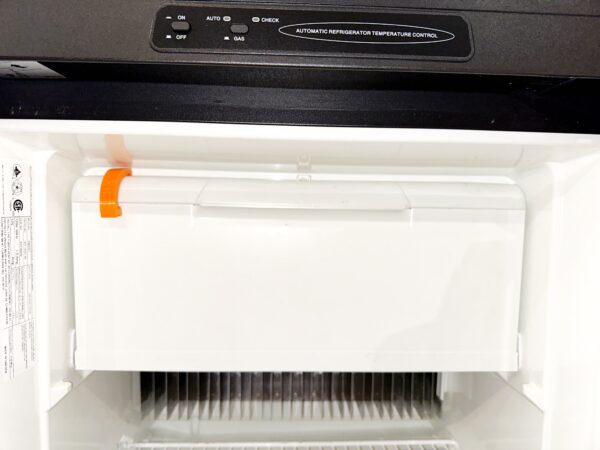 Dometic RV freezer door with IFIXIFI airing clip installed for safe off-season storage